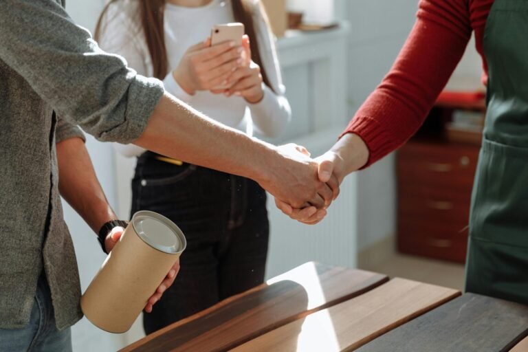 Client shaking hands with a reliable wood floor supplier after successful cooperation