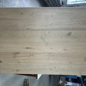 Stone Greige engineered oak flooring boards showing gray-beige tones, visible knots, and natural grain variation
