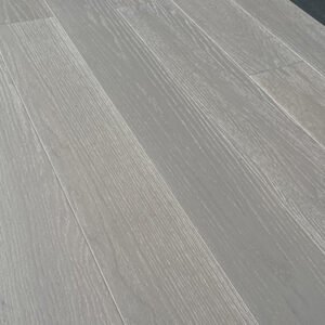 Light-toned red oak flooring boards showing visible grain and staggered end joints