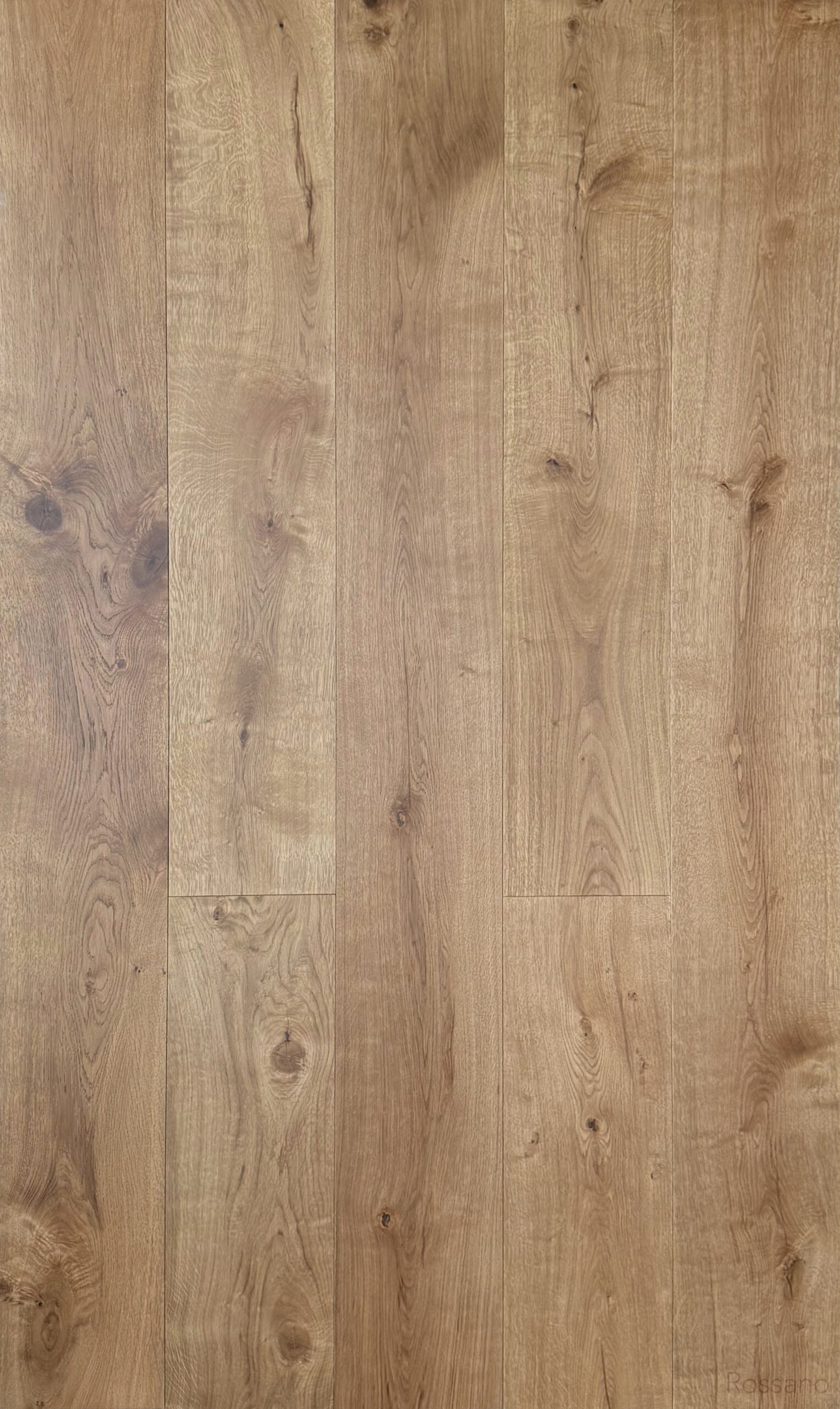 Auburn engineered hardwood flooring showing warm brown oak grain, visible knots, and variation between planks