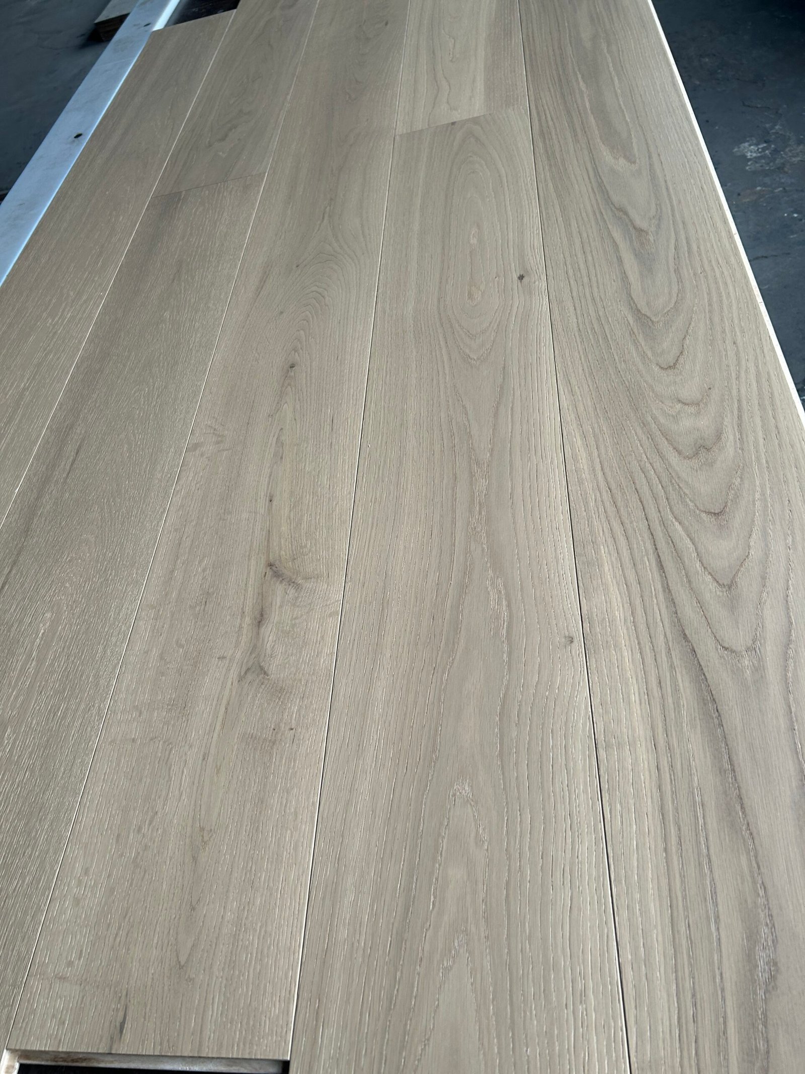 Stone Greige engineered oak flooring boards showing gray-beige tones, natural grain, and tonal variation