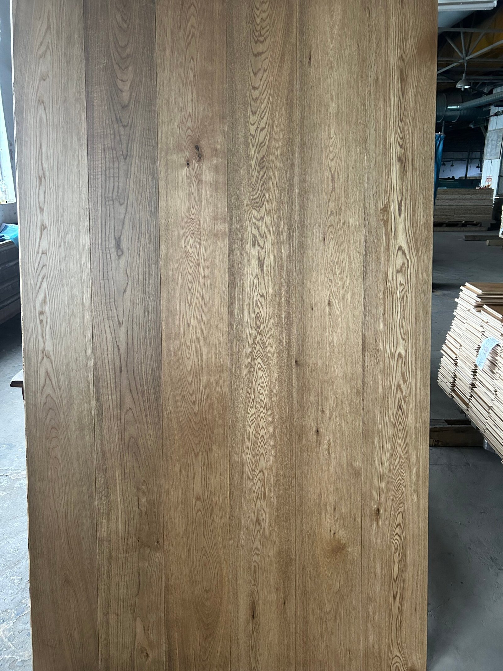 Warm Wheat engineered oak flooring boards displayed upright, showing warm brown tones and contrasting grain